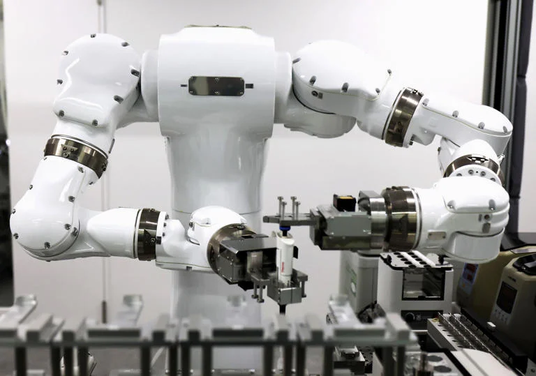 Tokyo University Launches Fully Autonomous Lab Where Robots Run the Show The lights are on at the University of Tokyo’s newest chemistry lab, but the lab coats are gone. In a move that signals a shift for experimental science, the university has officially opened a facility where robots handle the entire research cycle—from mixing chemicals to analyzing results—without a single human in the room. This isn’t just a room with a few automated arms. It’s a closed-loop system designed to hunt for new materials for batteries and semiconductors at speeds that make traditional methods look like they’re standing still. The AI designs the experiment, the robots execute it, and the data feeds right back into the AI to decide what happens next. "The goal is to remove the bottleneck of human physical labor," a researcher involved in the project’s pilot phase said. "A human can do maybe ten experiments a day. This system won't stop at ten, and it doesn't need to go home at 5:00 PM." The stakes are high. Japan is currently locked in a global race to find more efficient materials for the next generation of electric vehicle batteries. By cutting humans out of the "pipette-and-wait" cycle, the university expects to compress years of trial-and-error into a few weeks of non-stop robotic iteration. It’s a response to a looming crisis, too. Japan’s shrinking workforce means there are fewer young scientists entering the field every year. Automating the grunt work isn't just about speed; it’s about survival in a country where human talent is becoming a scarce resource. Critics often worry that "robot-run" means "job-lost," but the university’s lead engineers argue the opposite. They say the move frees up researchers to actually think, rather than spending eight hours a day performing repetitive liquid handling. The robots don't get bored, they don't make clerical errors, and they don't suffer from "Friday afternoon" fatigue that can ruin a data set. The lab is currently focused on thin-film materials, but the team plans to scale the technology to other branches of chemistry soon. If it works, the image of the lone scientist hunched over a workbench might soon be a relic of the past. The lab is running right now. It’ll be running tomorrow morning. And it won't need a coffee break to get through the night.