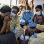 Ebola Mourning Under Restrictions: Families Adapt to Safe Burial Practices