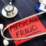 Medicare fraud sign and stethoscope with papers.