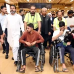 Four rescued Pakistani sailors arrive at Karachi airport